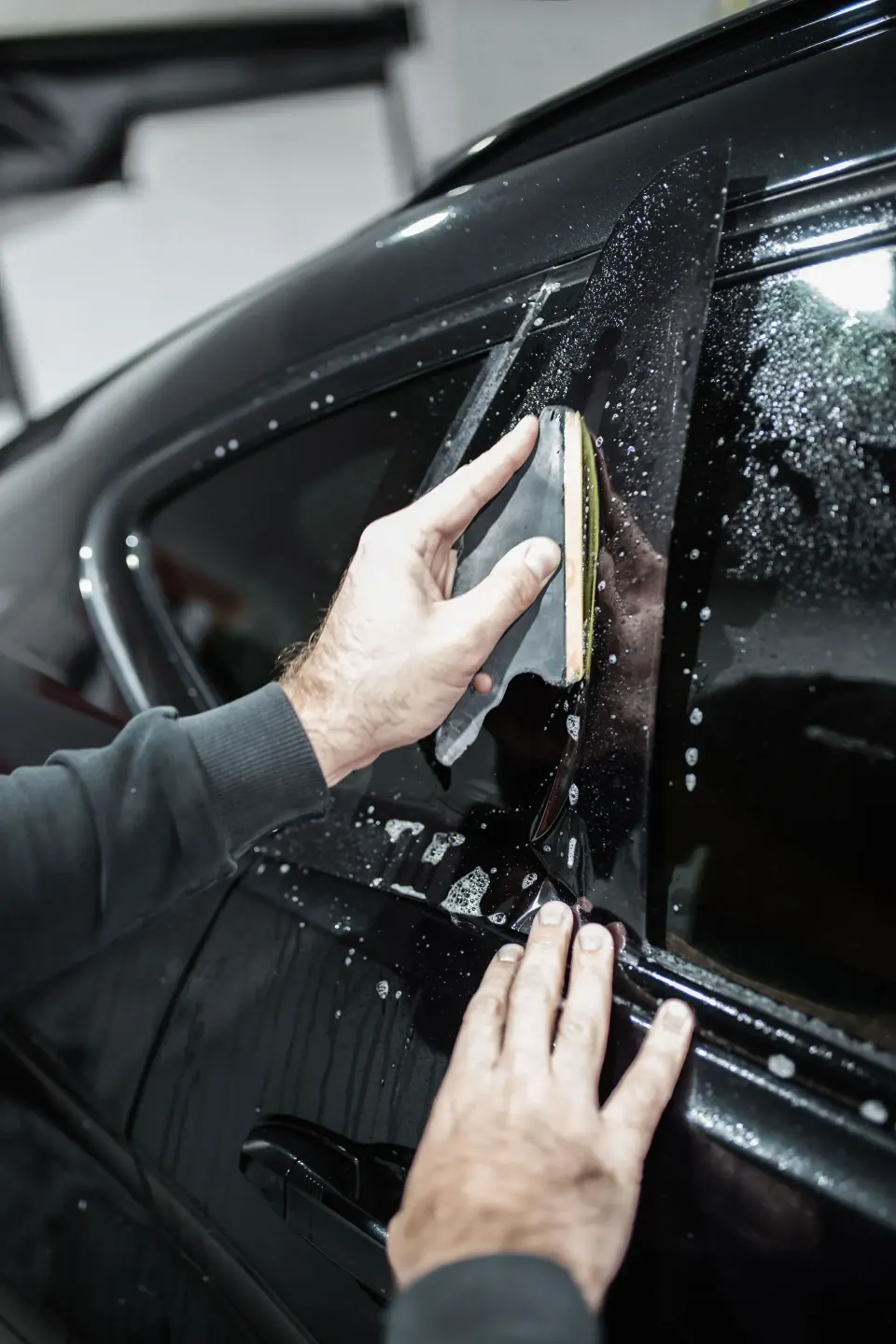 Window tinting service at Moojo Auto Spa